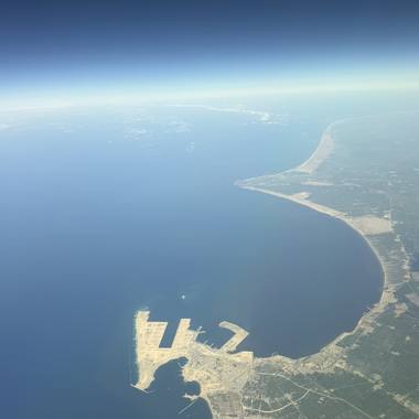 A port on a long curving shore on the Egyptian coast